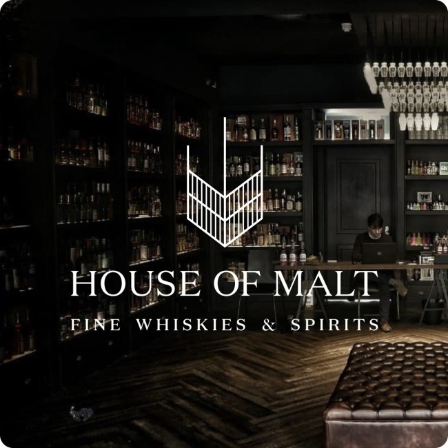 The House of Malt logo superimposed on an image of a whiskey store.